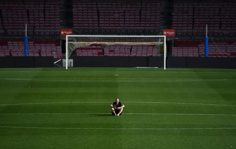 BARCELONA, SPAIN - MAY 20:  Andres Iniesta of FC Barcelona sits on the pitch at the end of La Liga match between Barcelona and Real Sociedad at Camp Nou on May 20, 2018 in Barcelona, Spain. The FC Barcelona captain played his last match with the FC Barcelona.  (Photo by David Ramos/Getty Images)