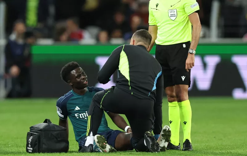 Lens, France, 3rd October 2023. Bukayo Saka of Arsenal receives medical treatment during the UEFA Champions League match at the Estadio Bollaert Delelis, Lens. Picture credit should read: David Klein / Sportimage EDITORIAL USE ONLY. No use with unauthorised audio, video, data, fixture lists, club/league logos or live services. Online in-match use limited to 120 images, no video emulation. No use in betting, games or single club/league/player publications. SPI-2623-0040