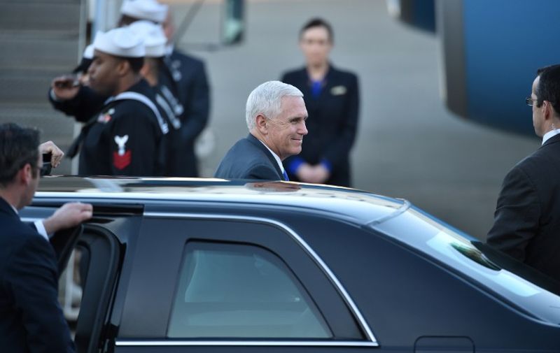 US Vice President Mike Pence (C) exits his car as he prepares to depart Japan from the US naval air facility in Atsugi, Kanagawa prefecture on April 19, 2017.
Pence is in the region to reassure allies fretting over Pyongyang's quickening missile programme, and its apparent readiness to carry out another banned nuclear test in its quest to develop an atomic weapon that can hit the US mainland.
 / AFP PHOTO / Kazuhiro NOGI