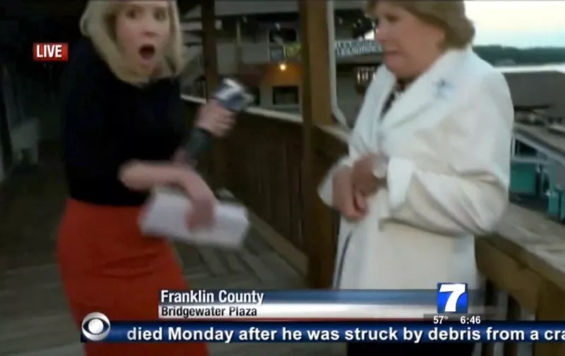 This TV video frame grab courtesy of WDBJ7-TV in Roanoke, Virginia shows Alison Parker (L) the moment shots ring out during an interview on tourism with Vicki Gardner, the local chamber of commerce director, before she was shot and killed.  Two WDBJ7 employees were killed in an attack at Bridgewater Plaza in Moneta, Virginia on August 26, 2015. The crime happened during a live broadcast around 6:45 a.m ET. Police are looking for a suspect who apparently opened fire on WDBJ7's photographer Adam Ward and reporter Alison Parker. Adam was 27-years-old and Alison just turned 24. Both were from the WDBJ7 viewing area. Bridgewater Plaza is on Smith Mountain Lake. Adam graduated from Salem High School and Virginia Tech. Alison grew up in Martinsville and attended Patrick Henry Community College and James Madison University. AFP PHOTO/WDBJ7/HANDOUT = RESTRICTED TO EDITORIAL USE - MANDATORY CREDIT "AFP PHOTO /WDBJ7-TV " - NO MARKETING NO ADVERTISING CAMPAIGNS - DISTRIBUTED AS A SERVICE TO CLIENTS =NO A LA CARTE SALES