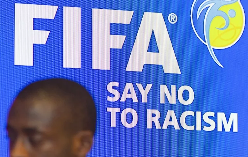 Manchester City's Ivorian midfielder Yaya Toure speaks during the launch of the FIFA's Anti-Discrimination Monitoring System at Wembley Stadium in west London on May 12, 2015, which will be implemented in the 2018 World Cup. FIFA will send observers trained by the European anti-discrimination organisation FARE to qualifying matches where there is felt to be a high risk of racist behaviour from fans.   AFP PHOTO/JUSTIN TALLIS / AFP / JUSTIN TALLIS