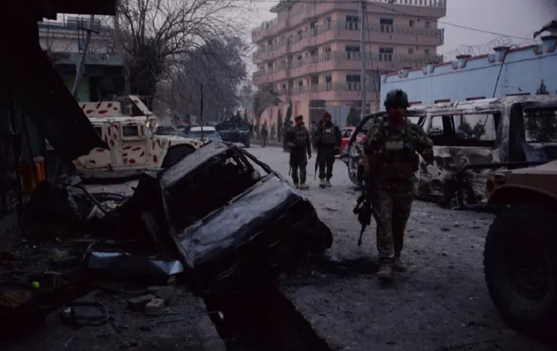 Afghan security forces inspect the site of attack on British charity Save the Children office in Jalalabad on January 24, 2018.
Save the Children suspended  operations across Afghanistan on WJanuary 24 as Islamic State militants terrorised staff trapped inside one of its offices in an hours-long attack, the latest assault on a foreign charity. Gunmen blasted their way into the British aid group's compound in the eastern city of Jalalabad, killing at least three people and wounding 24. / AFP PHOTO / Noorullah SHIRZADA