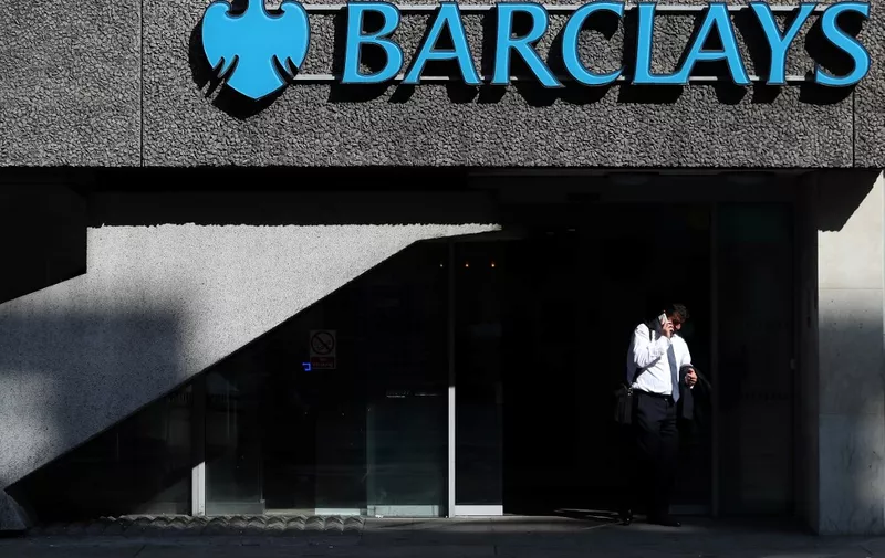 (FILES) In this file photo taken on July 25, 2018 A pedestrian walks past a branch of Barclays bank in central London. - British bank Barclays rebounded into net profit in the first quarter, as a year-earlier heavy US fine was not repeated this time around, it said April 25, 2019. Profit after taxation hit £1.04 billion ($1.34 billion, 1.20 billion euros) in the three months to the end of March, Barclays said in a results statement. (Photo by DANIEL LEAL-OLIVAS / AFP)