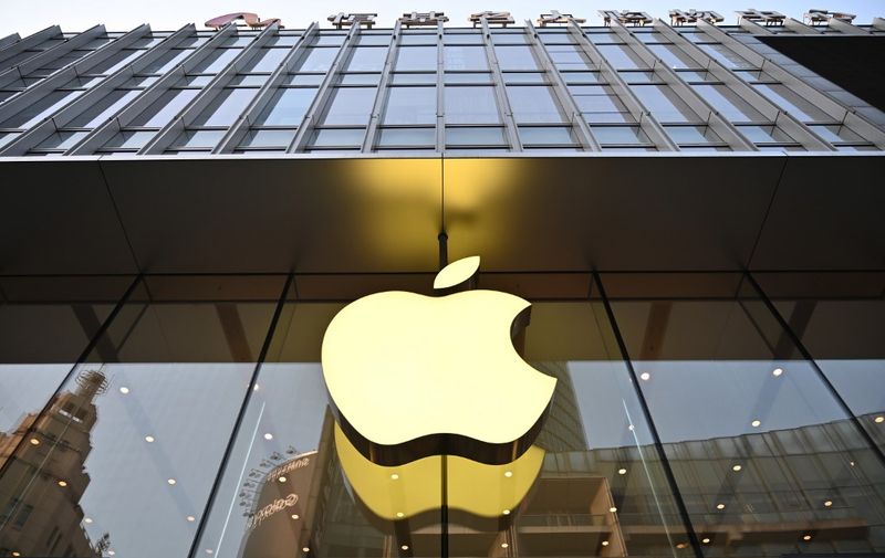 An Apple logo is displayed at store in Shanghai on May 10, 2019. (Photo by HECTOR RETAMAL / AFP)