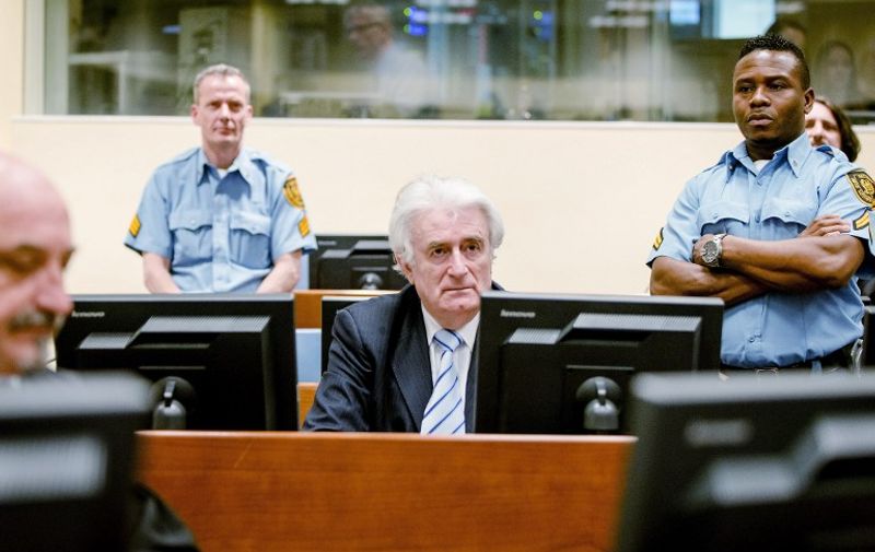 Bosnian Serb wartime leader Radovan Karadzic sits in the courtroom during the reading of his verdict at the International Criminal Tribunal for Former Yugoslavia (ICTY) in The Hague, on March 24, 2016.
The former Bosnian-Serbs leader is indicted for genocide, crimes against humanity, and war crimes.  / AFP / POOL / Robin van Lonkhuijsen / Netherlands OUT
