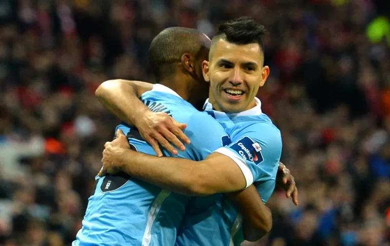 Manchester City's Brazilian midfielder Fernandinho (L) celebrates with Manchester City's Argentinian striker Sergio Aguero after scoring the opening goal of the English League Cup final football match between Liverpool and Manchester City at Wembley Stadium in London on February 28, 2016. / AFP / GLYN KIRK / RESTRICTED TO EDITORIAL USE. No use with unauthorized audio, video, data, fixture lists, club/league logos or 'live' services. Online in-match use limited to 75 images, no video emulation. No use in betting, games or single club/league/player publications.  /