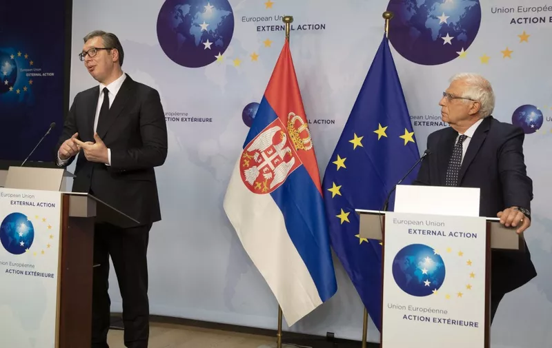 European Union foreign policy chief Josep Borrell (R) and Serbian President Aleksandar Vucic participate in a media conference at the EEAS building in Brussels on April 26, 2021. (Photo by Virginia Mayo / POOL / AFP)