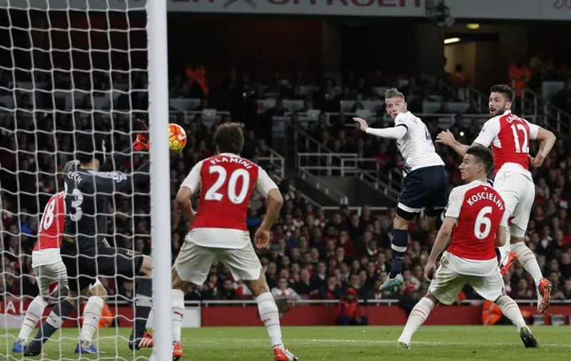 Arsenal's Czech goalkeeper Petr Cech (L) saves a header goalward by Tottenham Hotspur's Belgian defender Toby Alderweireld (3R) during the English Premier League football match between Arsenal and Tottenham Hotspur at the Emirates Stadium in London on November 8, 2015.    

RESTRICTED TO EDITORIAL USE. No use with unauthorized audio, video, data, fixture lists, club/league logos or 'live' services. Online in-match use limited to 75 images, no video emulation. No use in betting, games or single club/league/player publications.