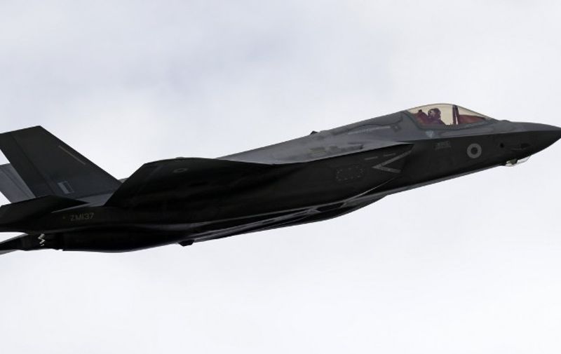 The Lockheed Martin F-35 Lightning II takes part in a flying display at the Farnborough Airshow, south west of London, on July 12, 2016.  / AFP PHOTO / ADRIAN DENNIS