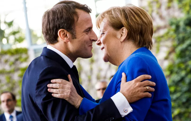 BERLIN, GERMANY - APRIL 29: German Chancellor Angela Merkel greets French President Emmanuel Macron upon his arrival at the Chancellery for the Western Balkans Conference on April 29, 2019 in Berlin, Germany. German Chancellor Angela Merkel and French President Emmanuel Macron are hosting the conference that includes the leaders of North Macedonia, Albania, Croatia, Bosnia-Herzegovina, Serbia, Kosovo, Montenegro and Slovenia. (Photo by Carsten Koall/Getty Images)