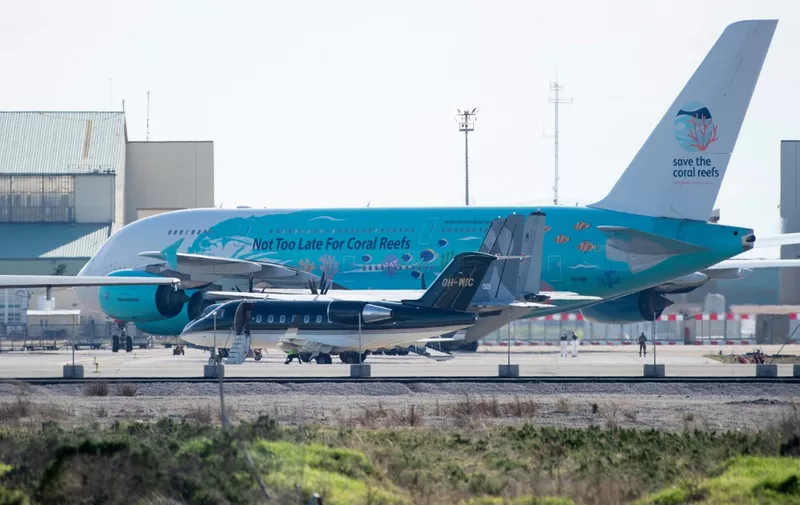 An Airbus A380-841 of airline Hi Fly, believed to be carrying European citizens flown out from the coronavirus zone in Wuhan, China, is pictured upon arrival at the Istres-Le Tube Air Base near Istres, northwest of Marseille, southern France on February 2, 2020. - A second plane carrying around 200 French citizens flew out of virus-hit Wuhan on February 2. (Photo by CLEMENT MAHOUDEAU / AFP)