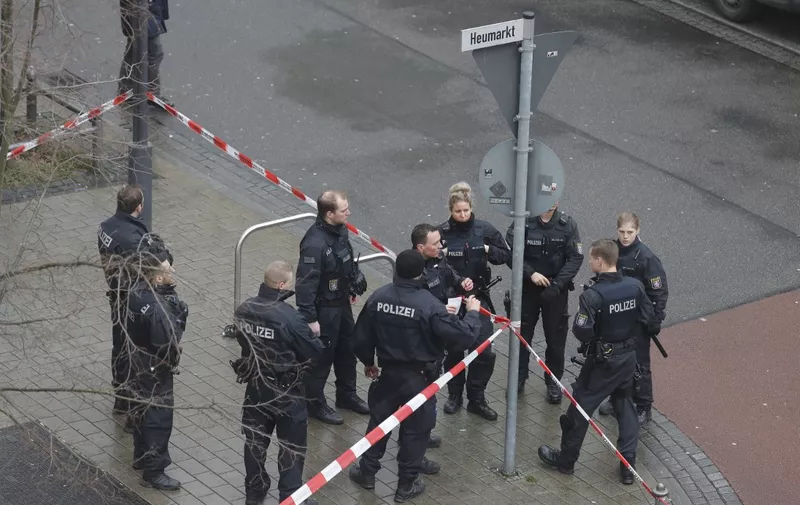 Police officers secure a street near one of the bar target in a shooting at the Heumarkt in the centre of Hanau, near Frankfurt am Main, western Germany, on February 20, 2020, where at least nine people were killed in two shootings late on February 19, 2020. - The suspect in two shootings in Germany that killed at least nine people was found dead at home, police said on February 20, 2020. At least nine people were killed in two shootings late on February 19 in Hanau, near the German city of Frankfurt. (Photo by Odd ANDERSEN / AFP)