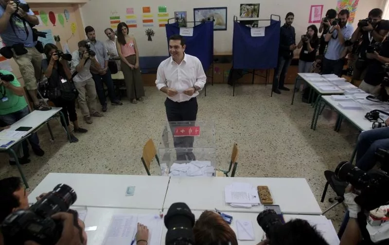 GREECE-ATHENS-ELECTIONS(150920) -- ATHENS, Sept. 20, 2015 (Xinhua) -- Leader of the Radical Left SYRIZA party and former Prime Minister Alexis Tsipras prepares to cast his vote at a polling station in Athens, capital of Greece, on Sept. 20, 2015. Greek voters started casting their ballots Sunday in the second general elections this year to elect a new government that will implement the latest three year bailout agreed in the summer with international creditors. (Xinhua/Marios Lolos)Marios Lolos Photo: XINHUA/PIXSELL