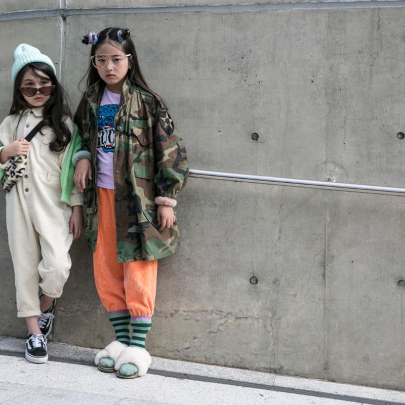 SEOUL, SOUTH KOREA - OCTOBER 17: Children are seen wearing white jumpsuit, camouflage jacket during the Seoul Fashion Week 2020 S/S at Dongdaemun Design Plaza on October 17, 2019 in Seoul, South Korea. (Photo by Jean Chung/Getty Images)