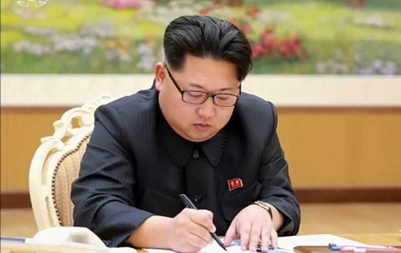 This picture taken from North Korean TV and released by South Korean news agency Yonhap on January 6, 2016 shows North Korean leader Kim Jong-Un signing a document of a hydrogen bomb test in Pyongyang.  North Korea announced on January 6 it had successfully carried out its first hydrogen bomb test, a development that, if confirmed, would marking a stunning step forward in its nuclear development.  REPUBLIC OF KOREA OUT -- RESTRICTED TO SUBSCRIPTION USE  --  AFP PHOTO / North Korean TV via YONHAP 
-- NO MARKETING - NO ADVERTISING CAMPAIGNS - DISTRIBUTED AS A SERVICE TO CLIENTS
-- THIS PICTURE WAS MADE AVAILABLE BY A THIRD PARTY. AFP CAN NOT INDEPENDENTLY VERIFY THE AUTHENTICITY, LOCATION, DATE AND CONTENT OF THIS IMAGE. THIS PHOTO IS DISTRIBUTED EXACTLY AS RECEIVED BY AFP. / AFP / NORTH KOREAN TV / YONHAP