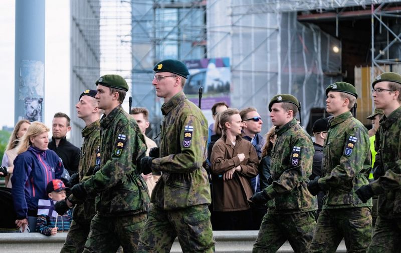 Soldiers march during the national parade on Mannerheimintie Street in Helsinki on June 4, 2022 as the country celebrates the Flag Day of the Finnish Defence Forces. (Photo by Alessandro RAMPAZZO / AFP)