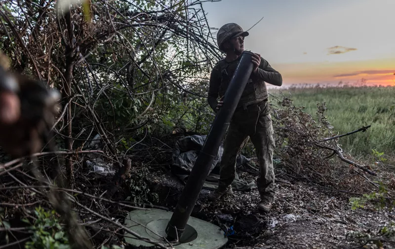DONETSK OBLAST, UKRAINE - AUGUST 21: A Ukrainian soldier prepares a 120mm mortar at their fighting position in the direction of Bakhmut frontline as the Russia-Ukraine war continues in Donetsk Oblast, Ukraine on August 21, 2023. Diego Herrera Carcedo / Anadolu Agency/ABACAPRESS.COM,Image: 799513834, License: Rights-managed, Restrictions: , Model Release: no
