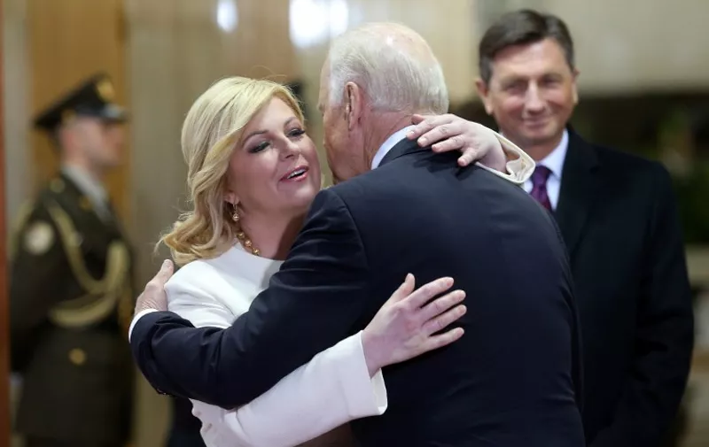 (LtoR) Croatian President Kolinda Grabar-Kitarovic welcomes US Vice-President Joe Biden next to Slovenian President Borut Pahor at the start of the Brdo-Brijuni Presidential Process summit, gathering heads of state from countries in the area of the former Yugoslavia plus Albania, in Zagreb on November 25, 2015. US Vice President Joe Biden arrived in Zagreb Wednesday for a Western Balkans summit, highlighting renewed interest from Washington in the fragile region as it deals with an unprecedented influx of refugees. AFP PHOTO /POOL/ STRINGER / AFP / POOL / -