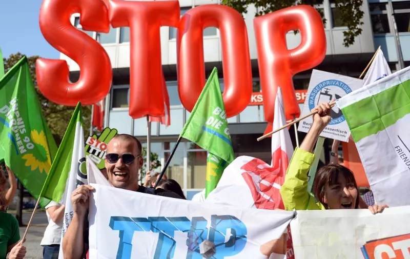 Members of the "Stop CETA &amp; TTIP" alliance rally on September 14, 2016 in Berlin to promote demonstrations planned to take place on September 17, 2016 in several cities across the country.
The alliance is running campaigns against CETA and TTIP because it's members "believe that these two trade and investment agreements must be stopped because they pose a threat to democracy, the rule of law, the environment, health, public services as well as consumer and labour rights". / AFP PHOTO / dpa / Britta Pedersen / Germany OUT