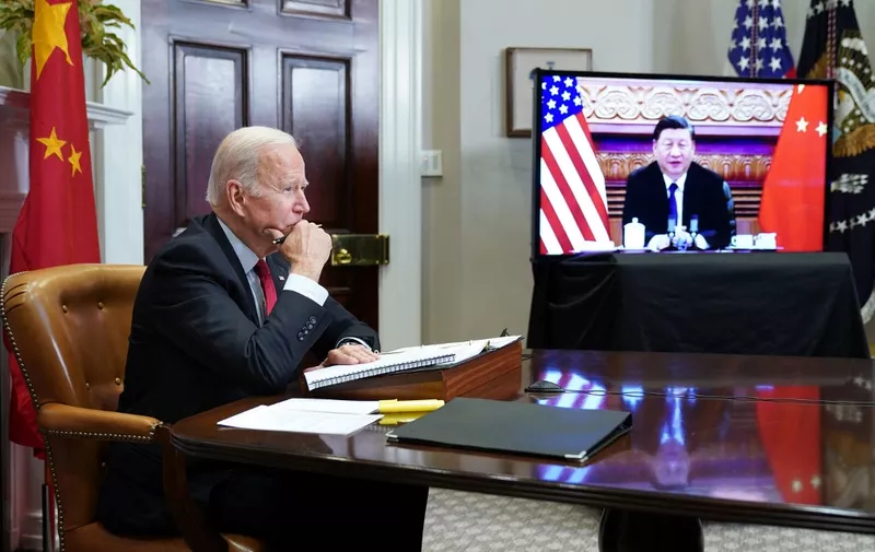(FILES) In this file photo taken on November 15, 2021 US President Joe Biden meets with China's President Xi Jinping during a virtual summit from the Roosevelt Room of the White House in Washington, DC. - US President Joe Biden will warn his Chinese counterpart Xi Jinping on Friday that he will face "costs" if Beijing rescues fellow authoritarian ally Russia from intense Western sanctions aimed at punishing Moscow's invasion of Ukraine.
The two leaders' first phone call since a video summit in November will be a chance to air differences as the United States spearheads an unprecedented pressure campaign on Russia, placing China in a geopolitical bind. (Photo by MANDEL NGAN / AFP)
