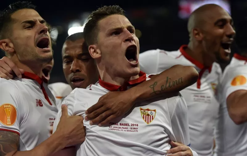 Sevilla's French forward Kevin Gameiro celebrates after scoring a goal during the UEFA Europa League final football match between Liverpool FC and Sevilla FC at the St Jakob-Park stadium in Basel, on May 18, 2016.  AFP PHOTO / MICHAEL BUHOLZER / AFP PHOTO / MICHAEL BUHOLZER