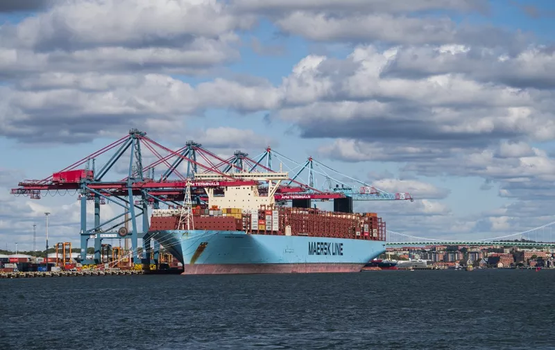 The container ship Maersk Murcia sits moored to a terminal in the port of Gothenburg, a busy shipping centre on the west coast of Sweden, as cargo is loaded onto it by crane before it sets sail on August 24, 2020. (Photo by Jonathan NACKSTRAND / AFP)