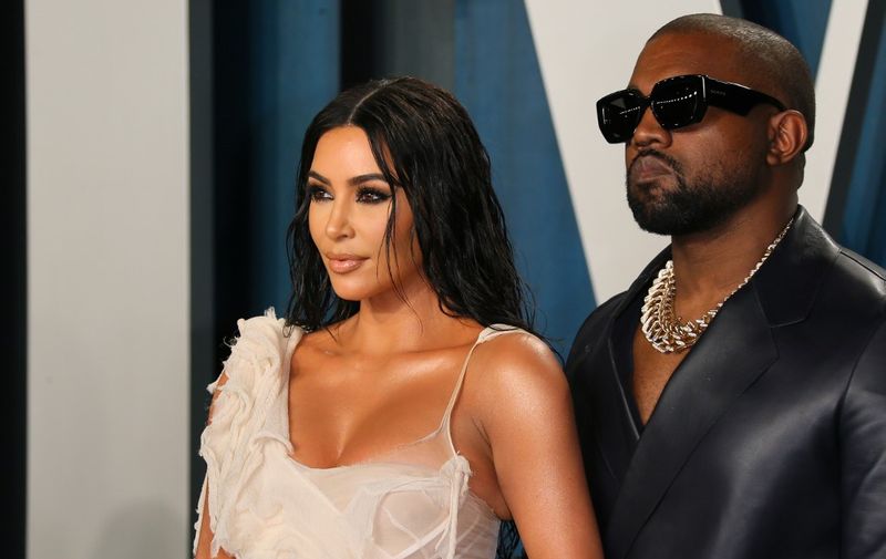 US media personality Kim Kardashian (L) and husband US rapper Kanye West attend the 2020 Vanity Fair Oscar Party following the 92nd Oscars at The Wallis Annenberg Center for the Performing Arts in Beverly Hills on February 9, 2020. (Photo by Jean-Baptiste Lacroix / AFP)