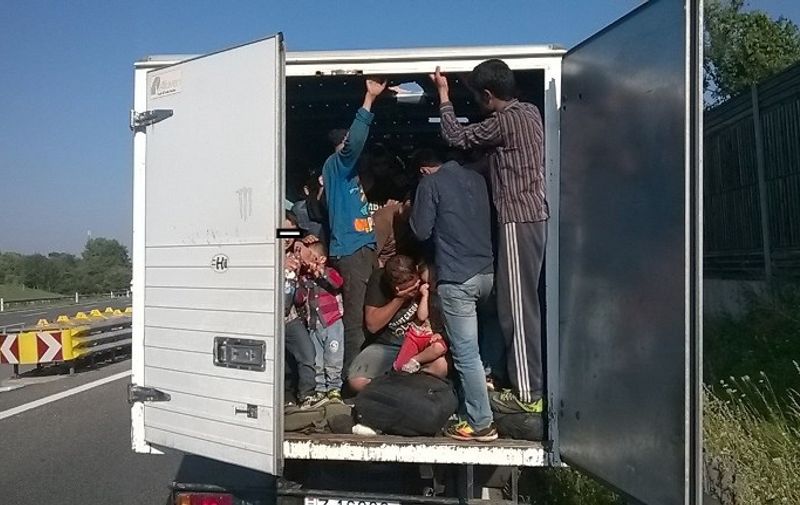 EDITORS NOTE ---- RESTRICTED TO EDITORIAL USE MANDATORY CREDIT "AFP PHOTO / AUSTRIAN POLICE / HO " NO MARKETING NO ADVERTISING CAMPAIGNS - DISTRIBUTED AS A SERVICE TO CLIENTS
This handout photo released by Austrian police on August 9, 2015 shows a truck packed with some 86 illegal refugees that was intercepted by the police on a highway in Austria.  AFP PHOTO / AUSTRIAN POLICE / HO