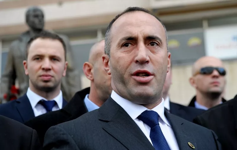 Kosovo former Prime Minister Ramush Haradinaj talks to the media after paying homage to the statue of ex-Kosovo Liberation Army (KLA) commander Zahir Pajaziti in Pristina on November 30, 2012. Haradinaj arrived in Pristina to a jubilant welcome after the UN court cleared him from charges of war crimes committed during the 1998-1999 conflict.AFP PHOTO/ARMEND NIMANI