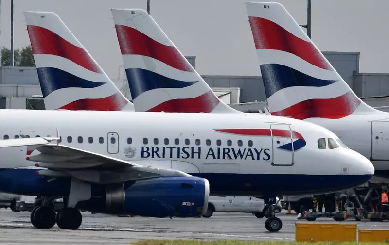 (FILES) In this file photo taken on May 03, 2019 British Airways passenger aircraft are pictured at London Heathrow Airport, west of London. - British Airways faced its first global strike by pilots on Monday September 9, and the possibility of almost all its flights being grounded for two days. (Photo by BEN STANSALL / AFP)