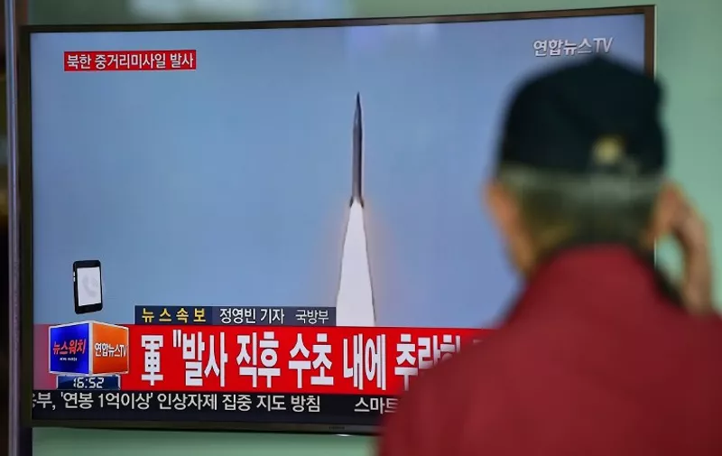 A man watches a TV news showing file footage of a North Korean missile launch at a railway station in Seoul on April 28, 2016.
North Korea on April 28 tried and failed in what appeared to be its second attempt in two weeks to test a powerful, new medium-range ballistic missile, South Korea's defence ministry said. / AFP PHOTO / JUNG YEON-JE
