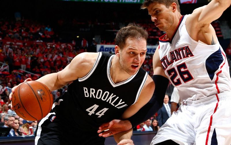 ATLANTA, GA - APRIL 29: Bojan Bogdanovic #44 of the Brooklyn Nets drives against Kyle Korver #26 of the Atlanta Hawks during Game Five of the Eastern Conference Quarterfinals of the NBA Playoffs at Philips Arena on April 29, 2015 in Atlanta, Georgia. NOTE TO USER: User expressly acknowledges and agrees that, by downloading and/or using this photograph, user is consenting to the terms and conditions of the Getty Images License Agreement.   Kevin C. Cox/Getty Images/AFP