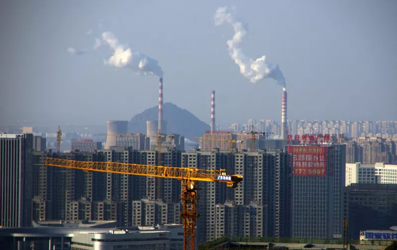 Smoke is discharged from chimneys at a coal-fired power plant in Ji'nan city, east China's Shandong province, 23 December 2016.

Costs are expected to escalate for Chinese mainland polluters with the passage on Sunday (25 December 2016) of a landmark environmental protection tax designed to reduce air, soil and water contamination. The legislation, which comes into effect in January 2018, will tax factories, power plants and other pollution emitters for releasing contaminants such as sulphur dioxide, a key contributor to the smog that has choked much of the country in the last couple of weeks. Analysts said the levies could be steep enough to push some dirty firms out of business, going some way to answering criticism that the central government has been half-hearted in tackling pollution. (Photo by Da qing / Imaginechina / Imaginechina via AFP)