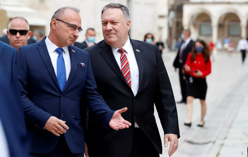 U.S. Secretary of State Mike Pompeo (C) speaks with Croatia's Foreign Minister Gordan Grlic Radman as he walks through the old city of Dubrovnik on October 2, 2020, as part of his six-day trip to Southern Europe. (Photo by Darko Bandic / POOL / AFP)