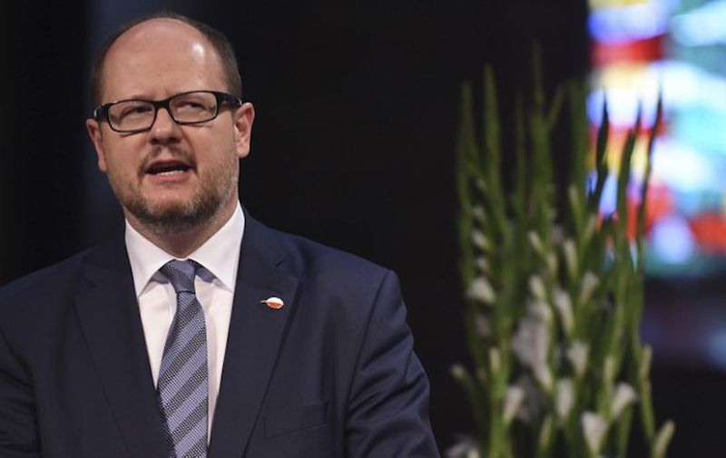 Picture taken on May 5, 2016 shows the mayor of Gdansk Pawel Adamowicz giving a speech during a commemorative ceremony at the St Petri Dom cathedral in Bremen, northwestern Germany. - The mayor of the Polish port city of Gdansk died on Monday, January 14, 2019, a day after a knife-wielding assailant stabbed him in the heart in front of hundreds of people at a charity event, local media reported. (Photo by Carmen Jaspersen / dpa / AFP) / Germany OUT