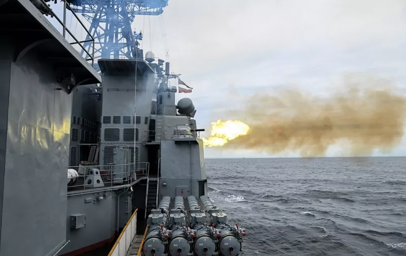 Russia's Marshal Shaposhnikov anti-submarine destroyer fires during the 'Vostok-2022' military exercises at the Peter the Great Gulf of the Sea of Japan outside the city of Vladivostok on September 5, 2022. The Vostok 2022 military exercises, involving several Kremlin-friendly countries including China, takes place from September 1-7 across several training grounds in Russia's Far East and in the waters off it. Over 50,000 soldiers and more than 5,000 units of military equipment, including 140 aircraft and 60 ships, are involved in the drills. (Photo by Kirill KUDRYAVTSEV / AFP)