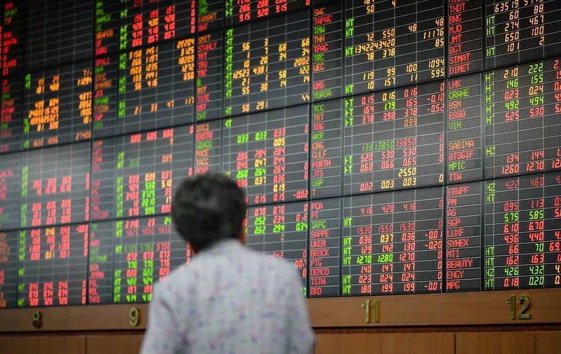 A Thai investor checks an electronic board showing stock prices at Asia Plus Securities amid Coronavirus threats in Bangkok
Coronavirus impact on financial markets, Bangkok, Thailand - 13 Mar 2020
Shares plunged in Asia on Friday, with benchmarks in Japan, Thailand and India sinking as much as 10% after Wall Street suffered its biggest drop since the Black Monday crash of 1987.,Image: 505958535, License: Rights-managed, Restrictions: , Model Release: no
