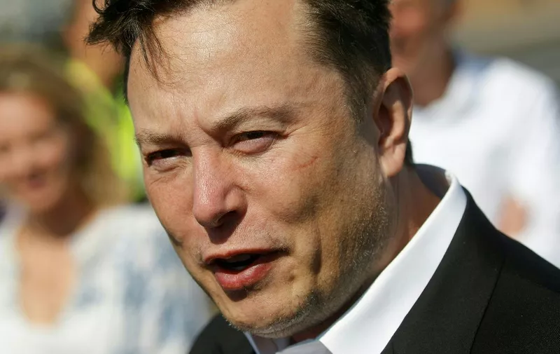 (FILES) In this file photo taken on September 3, 2020 Tesla CEO Elon Musk talks to media as he arrives to visit the construction site of the future US electric car giant Tesla, in Gruenheide near Berlin. - US billionaire Elon Musk was embroiled in a social media spat with Ukrainian officials including President Volodymyr Zelensky on October 3, 2022, over his ideas on ending Russia's invasion. (Photo by Odd ANDERSEN / AFP)
