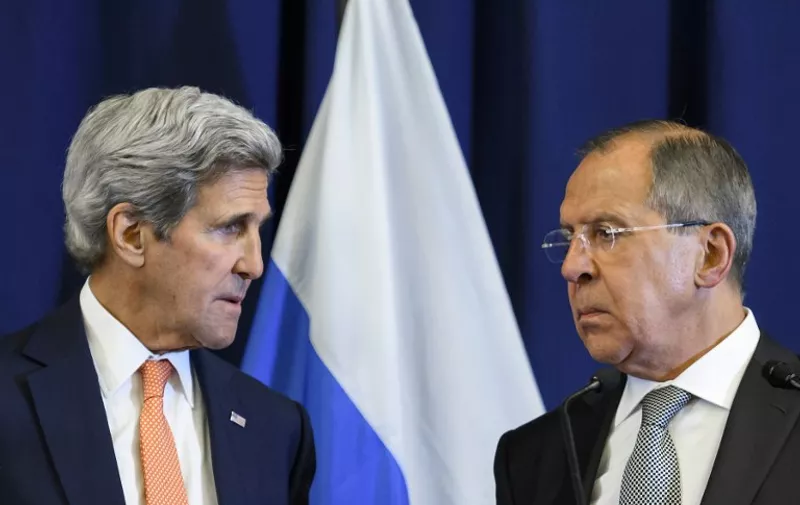 US Secretary of State John Kerry and Russian Foreign Minister Sergei Lavrov look toward one another during a press conference following their meeting in Geneva where they discussed the crisis in Syria on September 9, 2016.
The United State and Russia agreed a plan to impose a ceasefire in the Syrian civil war and lay the foundation of a peace process, US Secretary of State John Kerry said.
 / AFP PHOTO / FABRICE COFFRINI