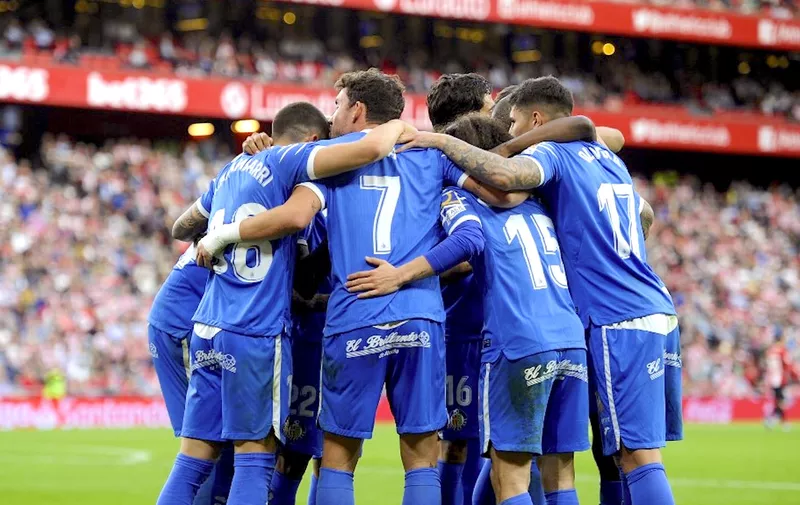 Getafe's players celebrate a goal by Spanish forward Jaime Mata (C) during the Spanish league football match between Athletic Club Bilbao and Getafe CF at the San Mames stadium in Bilbao on February 2, 2020. (Photo by ANDER GILLENEA / AFP)