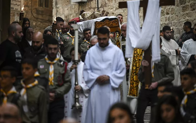 Scouts carry a statue of Jesus Christ during the Good Friday procession in Jerusalems Old City, on March 29, 2024. (Photo by RONALDO SCHEMIDT / AFP)