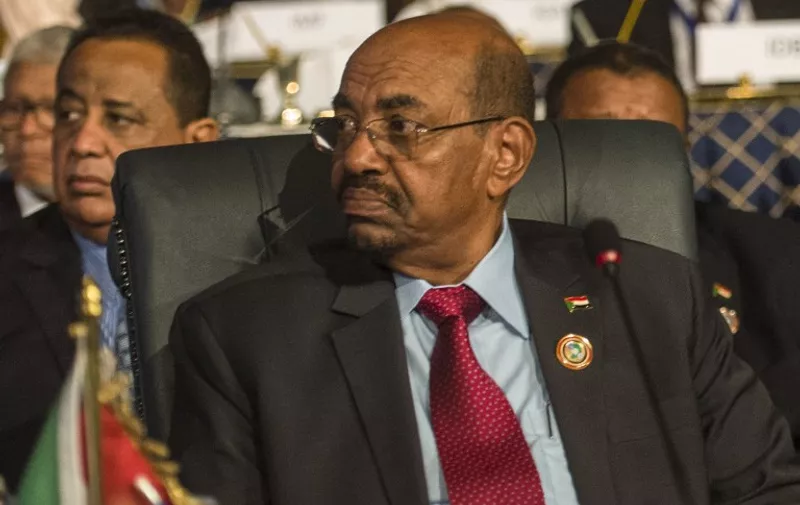 Sudanese President  Omar al-Bashir attends the closing session of an African summit meeting in the Egyptian resort of Sharm el-Sheikh on June 10, 2015. Senior African officials were negotiating a trade deal in Egypt to create a common market across half the continent, with the aim of raising Africa's share of global trade -- currently at about two percent. The deal between the East African Community, Southern African Development Community and the Common Market for Eastern and Southern Africa (COMESA) would create a 26-country market with a population of 625 million and gross domestic product worth more than $1 trillion (900 billion euros).  AFP PHOTO / KHALED DESOUKI