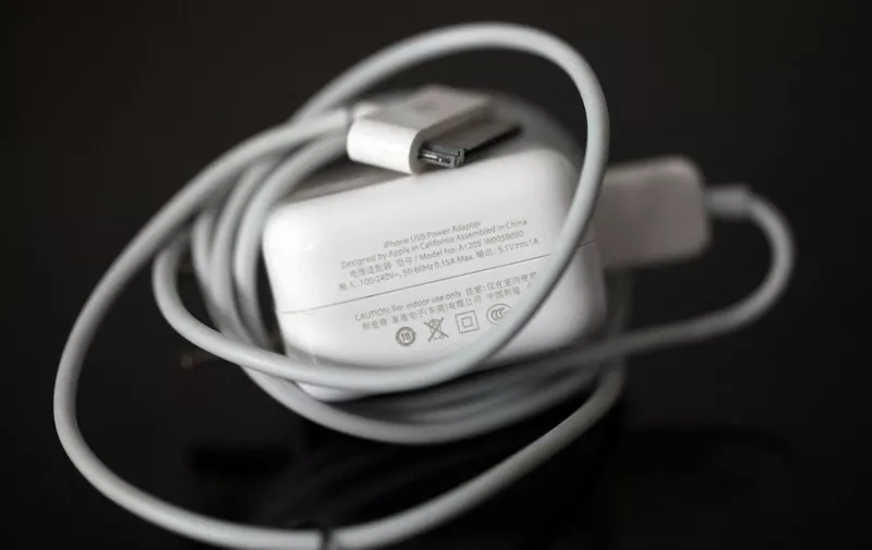 --FILE--View of an Apple iPhone USB Power Adapter in Tangyin county, Anyang city, central Chinas Henan province, 24 July 2013.

The death of a Chinese woman from a third-party iOS charger prompted Apple to launch a worldwide USB Power Adapter Takeback Program, under which it will sell discounted official Apple adapters to users who turn in third-party or counterfeit versions. Apple will sell the adapters, normally $19, for $10 starting August 9 in China and August 16 in the U.S. and elsewhere. (Photo by Chang zhongzheng / Imaginechina / Imaginechina via AFP)