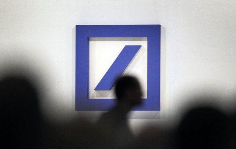 (FILES) This file photo taken on May 19, 2016 shows the logo of Germany's biggest lender Deutsche Bank during the company's annual shareholders' meeting in Frankfurt am Main, western Germany.
Shares in Deutsche Bank hit a record low on September 26, 2016 after reports at the weekend that Berlin had refused state aid for the embattled lender. / AFP PHOTO / DANIEL ROLAND