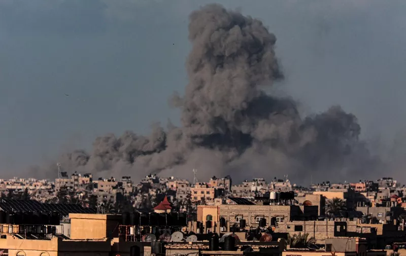 Smoke billows after Israeli bombardment on Khan Yunis as seen from Rafah, in the southern Gaza Strip on March 9, 2024, amid ongoing battles between Israel and the Palestinian militant group Hamas. (Photo by SAID KHATIB / AFP)