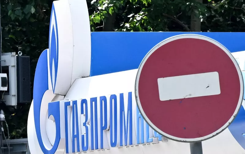 The logo of Russia's energy giant Gazprom is pictured at one of its petrol stations in Moscow on July 11, 2022. (Photo by Kirill KUDRYAVTSEV / AFP)