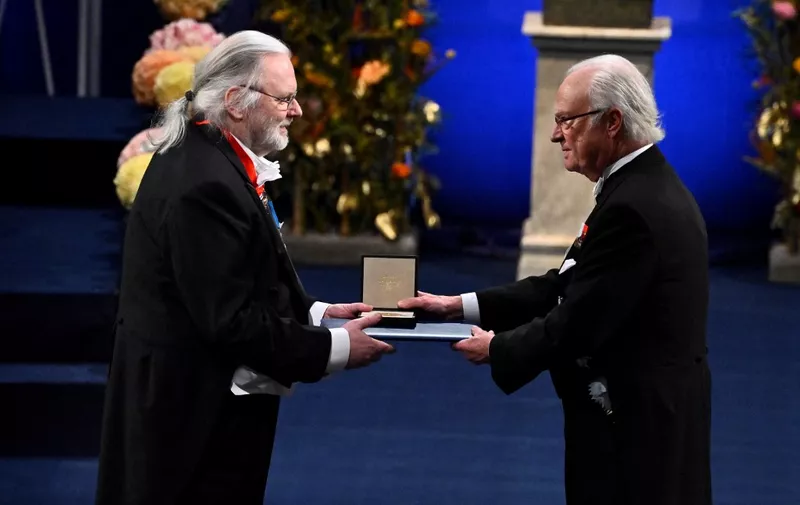 Nobel laureate in literature Jon Fosse is awarded by King Carl XVI Gustaf of Sweden during the Nobel awards ceremony at the Concert Hall in Stockholm, Sweden on December 10, 2023. (Photo by Claudio BRESCIANI / TT NEWS AGENCY / AFP) / Sweden OUT