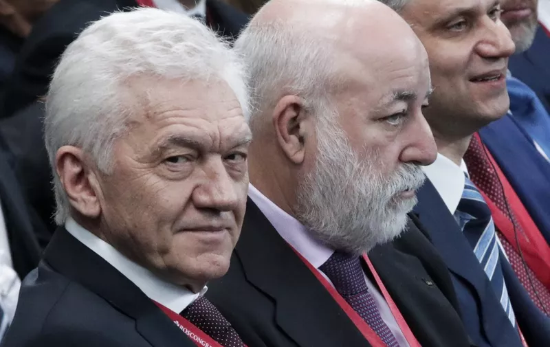 Russian tycoon Gennady Timchenko and Viktor Vekselberg of Renova Group along with other businessmen attend a meeting with Russian and French presidents during the Saint Petersburg International Economic Forum on May 25, 2018 in Saint Petersburg. (Photo by Dmitry LOVETSKY / POOL / AFP)
