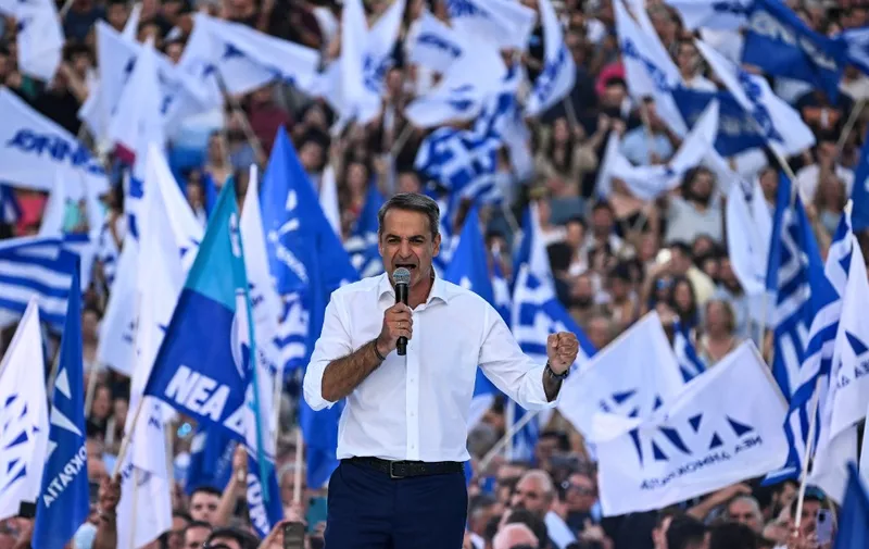 Greek former prime minister and leader of Greece's conservative party New Democracy, Kyriakos Mitsotakis, addresses his party's supporters during his last pre-election speech in Athens on June 23, 2023, two days ahead of general elections. Greece  entered the final day of campaigning ahead of the June 25 national election, with the conservative frontrunner aiming to consolidate the gains he made in the previous month's inconclusive ballot. (Photo by Aris MESSINIS / AFP)