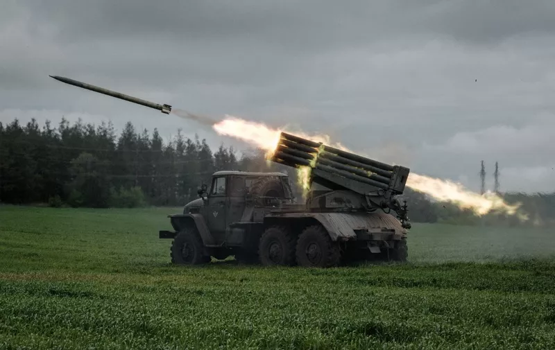 A rocket is launched from a truck-mounted multiple rocket launcher near Svyatohirsk, eastern Ukraine, on May 14, 2022, amid the Russian invasion of Ukraine. (Photo by Yasuyoshi CHIBA / AFP)